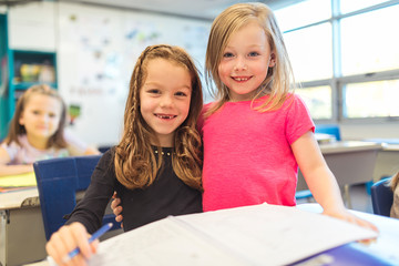 education and school concept little student girl together studying at school