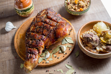 roast pork meat but with a bone on a wooden board