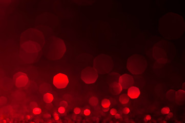 Abstract bokeh red and burgundy color circular background. Christmas light or season greeting background.Red shining lights,sparkling glittering new year lights. Blurred abstract holiday backdrop.