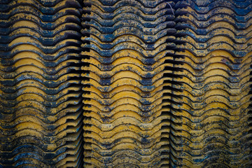 A stack of abandoned cement roof tiles