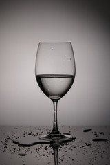 wineglass.Advertising glass and drinks on a light background. Champagne glass, wine glass with ice cubes, freeze frame.