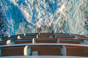 Detail of the stern of a cruise ship and the foam left by the propellers, Mediterranean sea. Concept: giant ship, power of propulsive thrust, luxury cruise