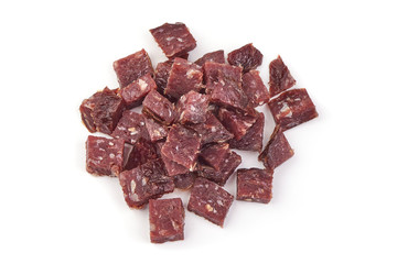 Dry sausage slices, cut by cubes, ingredients, isolated on white background