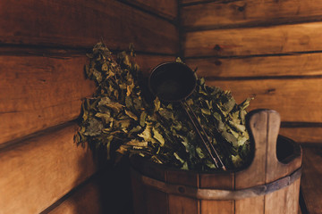 Tub and broom in the bath.