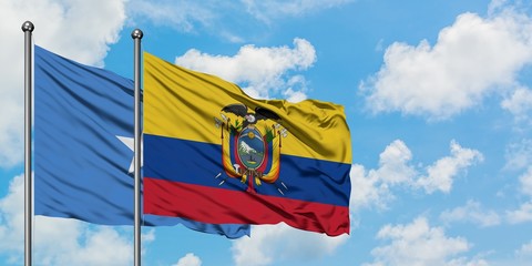 Somalia and Ecuador flag waving in the wind against white cloudy blue sky together. Diplomacy concept, international relations.