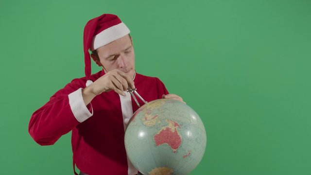 Adult Man Santa Claus Mesuring The Globe