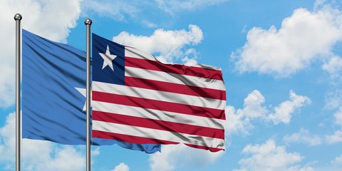 Somalia and Liberia flag waving in the wind against white cloudy blue sky together. Diplomacy concept, international relations.