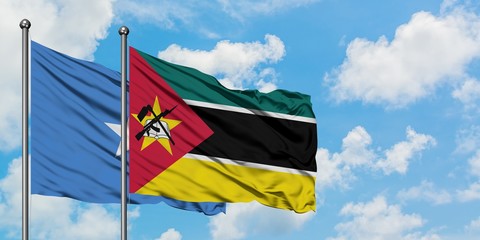Somalia and Mozambique flag waving in the wind against white cloudy blue sky together. Diplomacy concept, international relations.