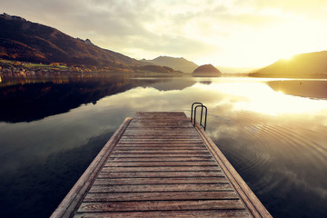 wood planking over the water surface on the mountain lake