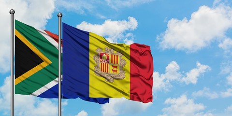 South Africa and Andorra flag waving in the wind against white cloudy blue sky together. Diplomacy concept, international relations.