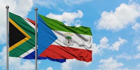 South Africa and Equatorial Guinea flag waving in the wind against white cloudy blue sky together. Diplomacy concept, international relations.