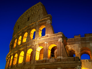 Fototapeta premium Night view of Colosseum in Rome, Italy. Rome architecture and landmark. Rome Colosseum is one of the main attractions of Rome and Italy