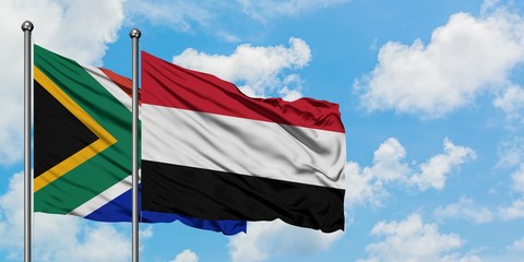 South Africa and Yemen flag waving in the wind against white cloudy blue sky together. Diplomacy concept, international relations.