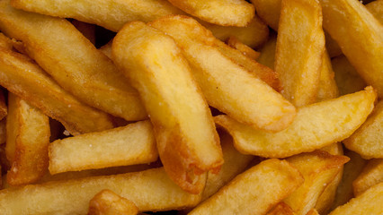 Close up of the golden coloured French fries.