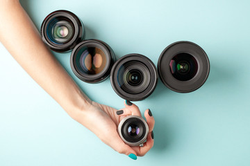 set of photo lenses on a colored background, the selection and comparison of photographic...