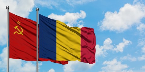 Soviet Union and Chad flag waving in the wind against white cloudy blue sky together. Diplomacy concept, international relations.