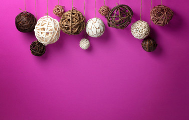 Rustic bauble decoration on purple background with free space. Christmas and New Year concept