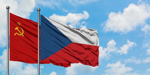 Soviet Union and Czech Republic flag waving in the wind against white cloudy blue sky together. Diplomacy concept, international relations.