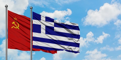 Soviet Union and Greece flag waving in the wind against white cloudy blue sky together. Diplomacy concept, international relations.