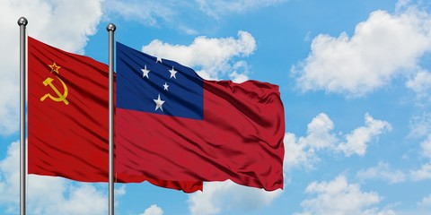 Soviet Union and Samoa flag waving in the wind against white cloudy blue sky together. Diplomacy...