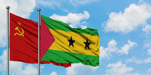 Soviet Union and Sao Tome And Principe flag waving in the wind against white cloudy blue sky together. Diplomacy concept, international relations.