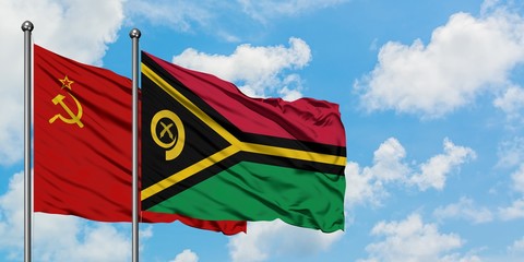 Soviet Union and Vanuatu flag waving in the wind against white cloudy blue sky together. Diplomacy concept, international relations.