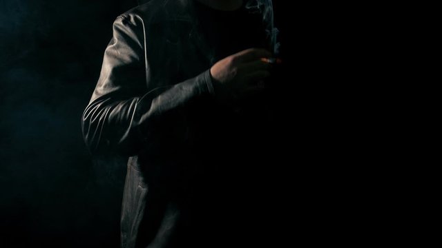 Anonymous Man Smoking In The Dark