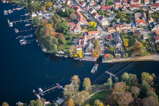 ferry terminal in Caputh, district of Schwielowsee, Germany, the ferry is crossing the river Havel and connects the district Geltow and Caputh - aerial view during early autumn 