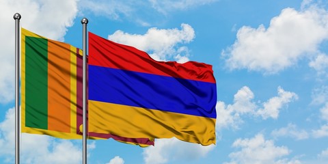 Sri Lanka and Armenia flag waving in the wind against white cloudy blue sky together. Diplomacy concept, international relations.