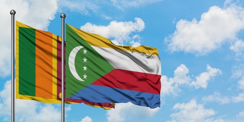 Sri Lanka and Comoros flag waving in the wind against white cloudy blue sky together. Diplomacy...