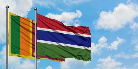 Sri Lanka and Gambia flag waving in the wind against white cloudy blue sky together. Diplomacy concept, international relations.