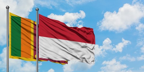 Sri Lanka and Indonesia flag waving in the wind against white cloudy blue sky together. Diplomacy concept, international relations.