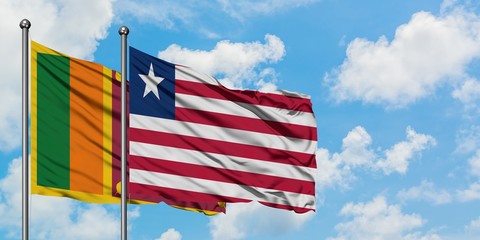 Sri Lanka and Liberia flag waving in the wind against white cloudy blue sky together. Diplomacy concept, international relations.