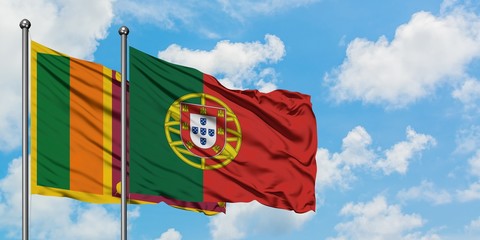 Sri Lanka and Portugal flag waving in the wind against white cloudy blue sky together. Diplomacy...