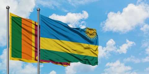 Sri Lanka and Rwanda flag waving in the wind against white cloudy blue sky together. Diplomacy concept, international relations.