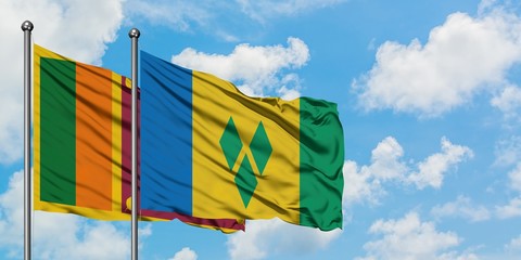 Sri Lanka and Saint Vincent And The Grenadines flag waving in the wind against white cloudy blue...