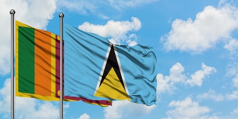 Sri Lanka and Saint Lucia flag waving in the wind against white cloudy blue sky together. Diplomacy concept, international relations.