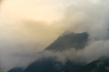 Beautiful landscape images of Sapa at sunrise and the surrounding mountains with their peaks poking out of clouds