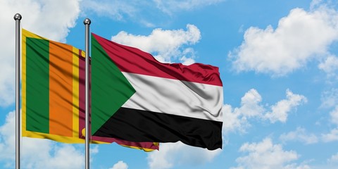 Sri Lanka and Sudan flag waving in the wind against white cloudy blue sky together. Diplomacy concept, international relations.