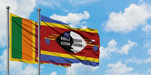 Sri Lanka and Swaziland flag waving in the wind against white cloudy blue sky together. Diplomacy concept, international relations.