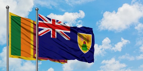 Sri Lanka and Turks And Caicos Islands flag waving in the wind against white cloudy blue sky together. Diplomacy concept, international relations.