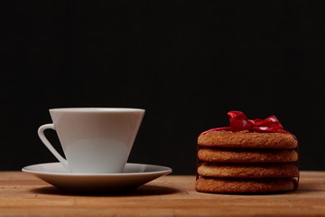 cup of coffee and cake on wooden table