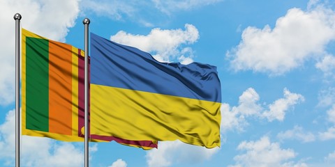 Sri Lanka and Ukraine flag waving in the wind against white cloudy blue sky together. Diplomacy...