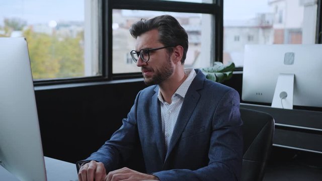 Stressed or unmotivated employee using computer desktop trying to concentrate tired of working long hours in the office.