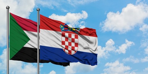 Sudan and Croatia flag waving in the wind against white cloudy blue sky together. Diplomacy concept, international relations.