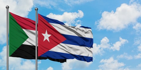 Sudan and Cuba flag waving in the wind against white cloudy blue sky together. Diplomacy concept, international relations.
