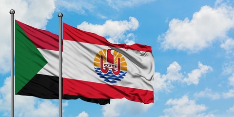 Sudan and French Polynesia flag waving in the wind against white cloudy blue sky together. Diplomacy concept, international relations.