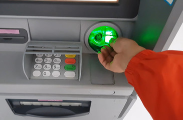 ATM for receiving funds. Hands of a man at an ATM.