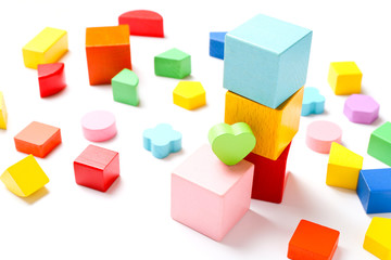 Colorful wooden cubes on white background.