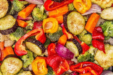Assorted fresh vegetables on a baking sheet. Healthy food lifestyle. Salt, oil, spices